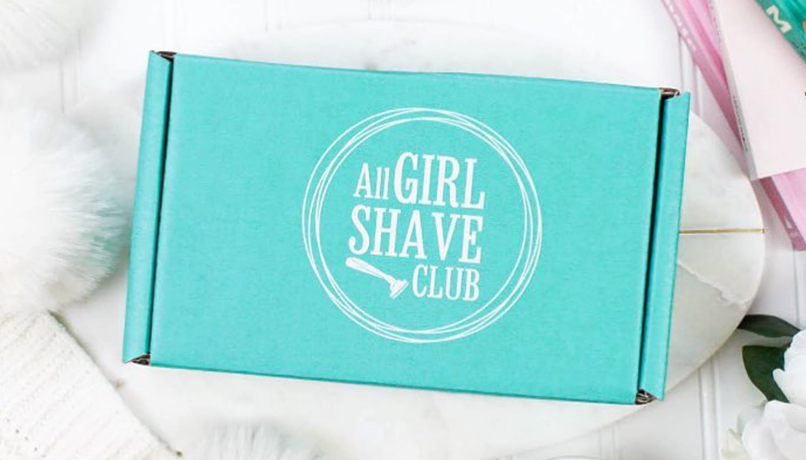 top view of all girl shave club box