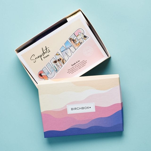 Birchbox branded container opened to show a stack of post cards