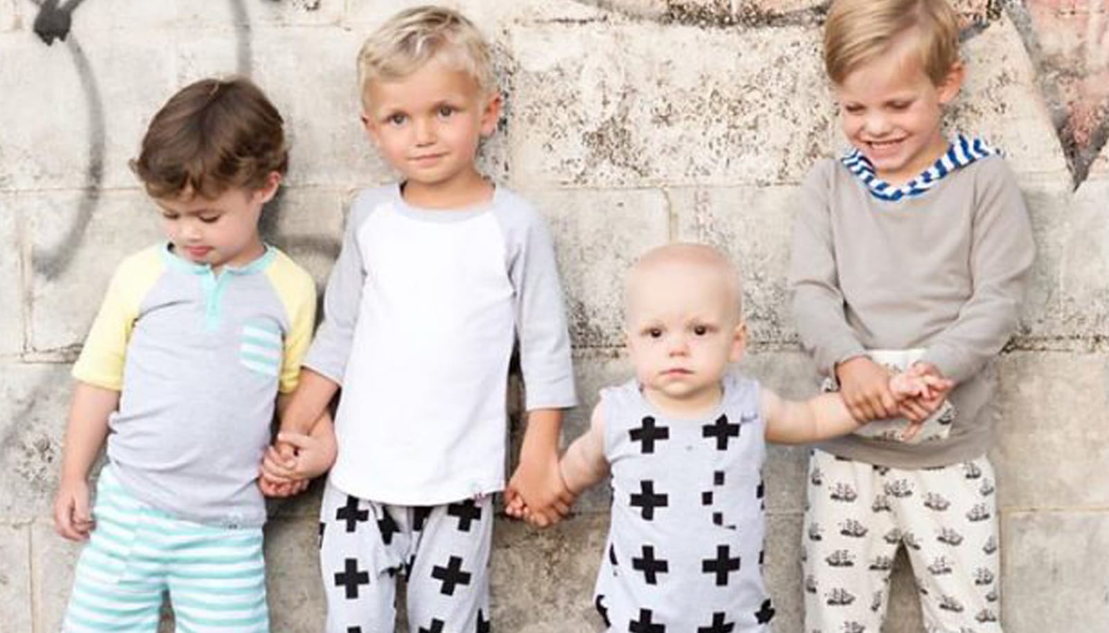 a row of children wearing trendy clothes